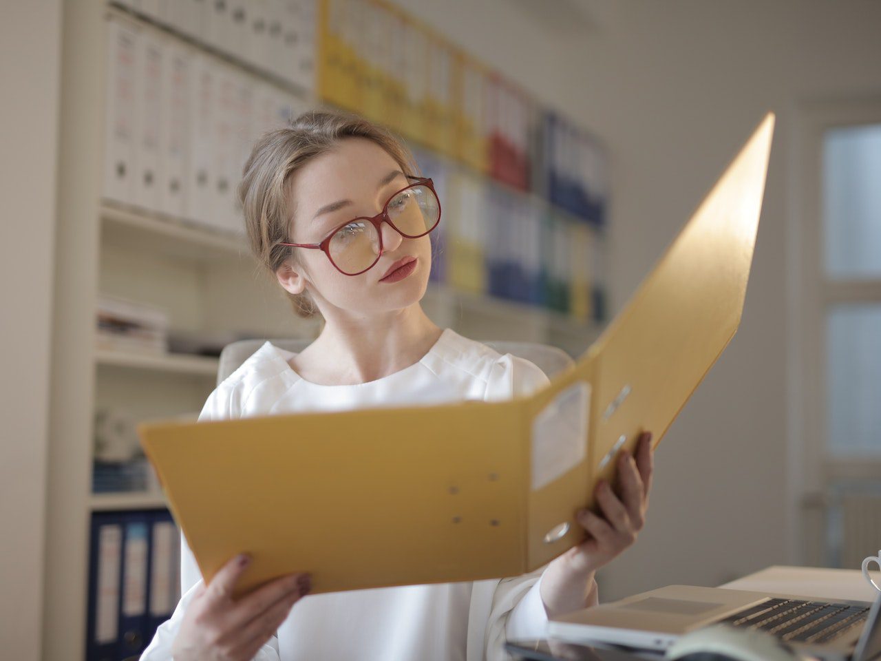 Female Accountant Looking at Documents